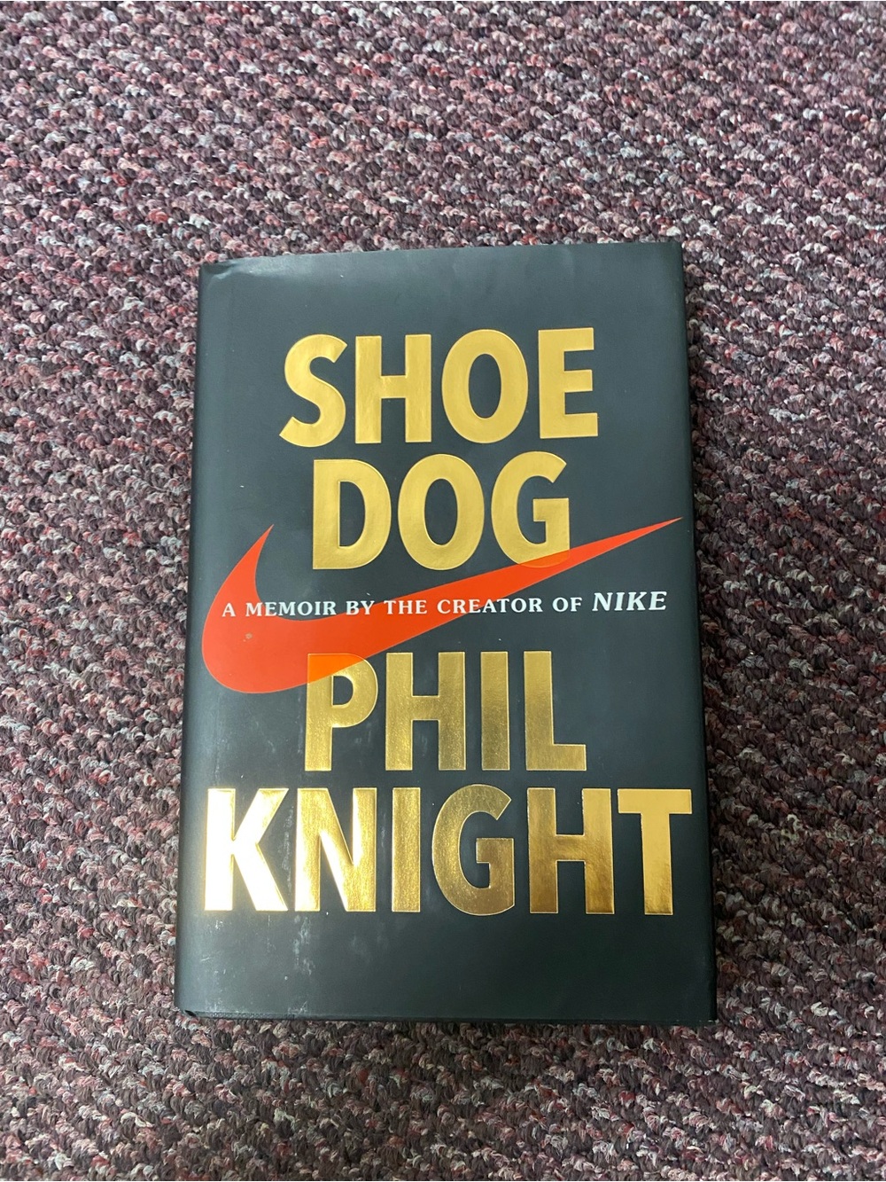 Nike Men's Black Shoe with Gold Lettering and Red Swoosh by Phil knight